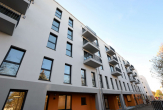 Objektansicht - 2-Zimmer-Wohnung mit Laminat und Balkon im Neubau von 2022 in zentraler Lage