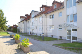 Objektansicht - Helle 2-Zimmer-Wohnung mit Terrasse und eigenem Gartenanteil